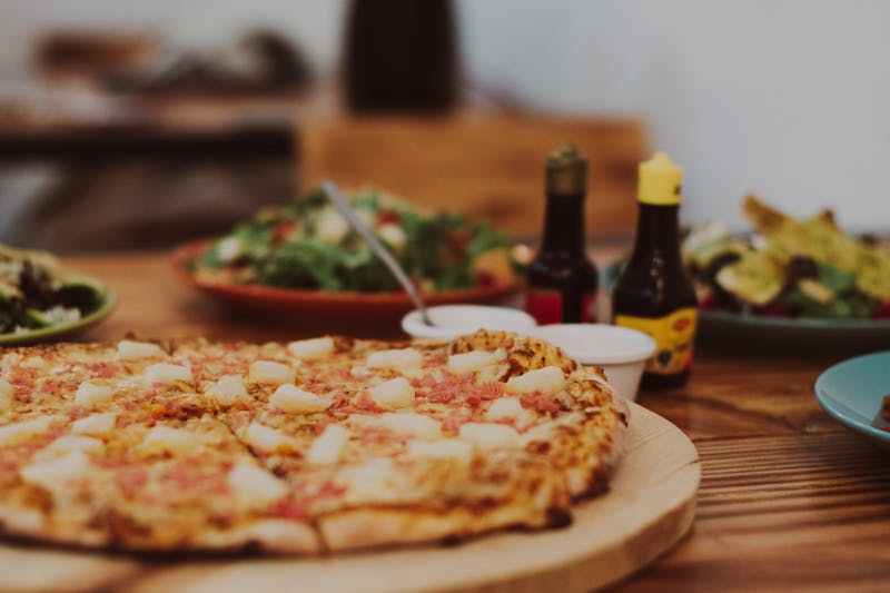Hawaiian ranch pizza with ham, pineapple and ranch sauce