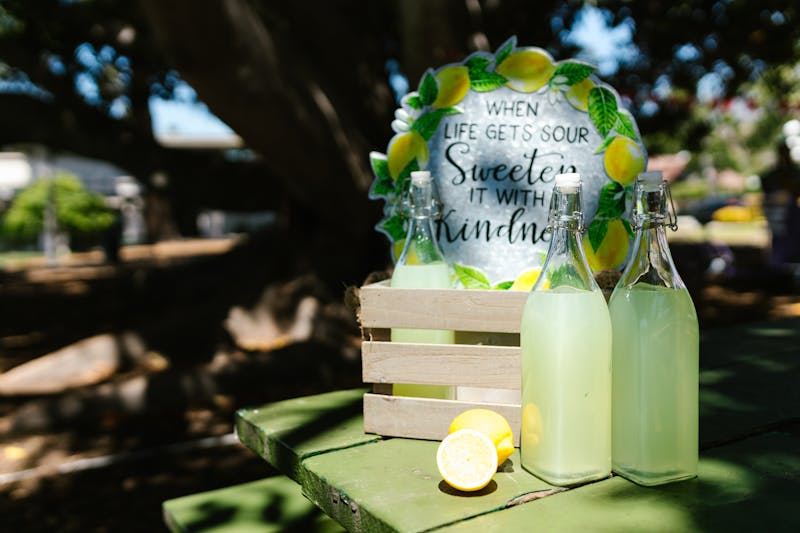 Fresh lemonade in a pitcher with lemon slices
