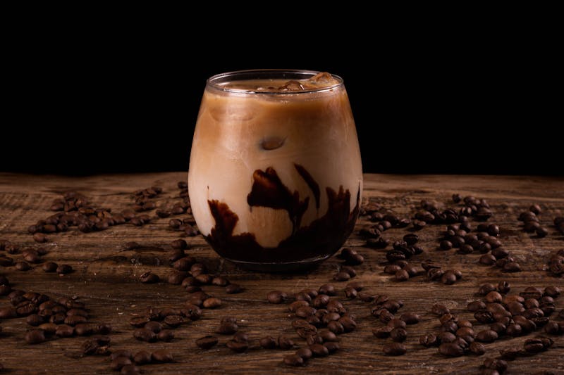 Iced coffee in a glass with cream